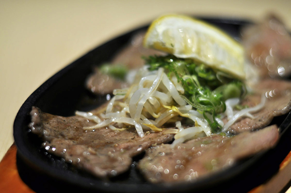 Beef tongue is common piece of meat for Japanese barbecue.  Lemon is great fit with tongue, makes very good taste. 