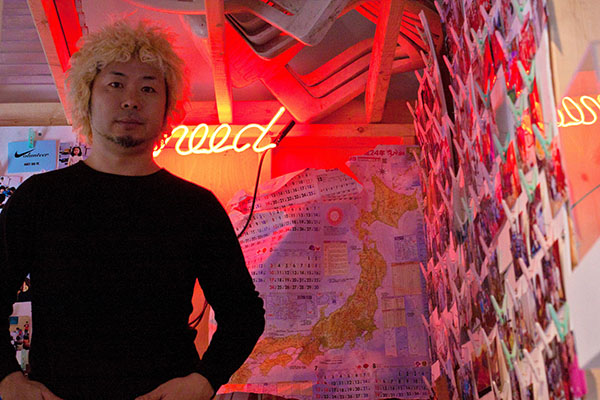 Daisuke Takeya in front of his 'God Loves Japan' exhibit at the Museum of Contemporary Art in 2012.